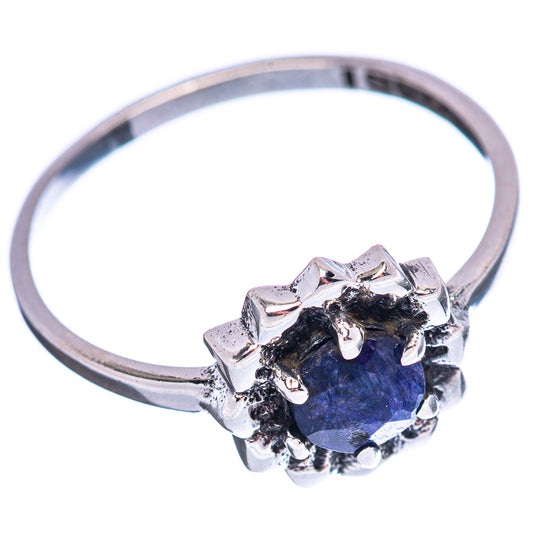 Sterling silver ring featuring blue oval stone in star-like bezel