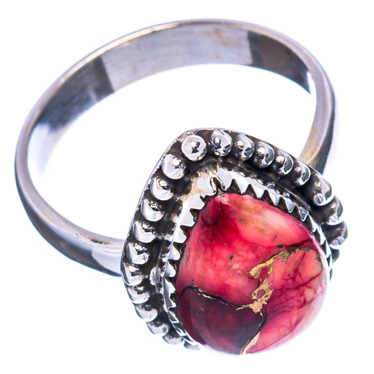 Sterling silver ring with red teardrop gemstone and beaded band in side view