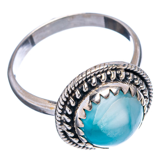 Sterling silver larimar ring featuring round bezel setting and bright blue oval stone