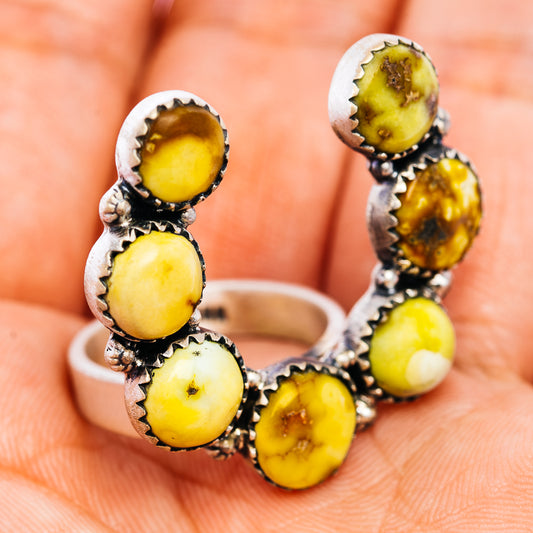 Adjustable sterling silver naja ring with six yellow oval gemstone settings
