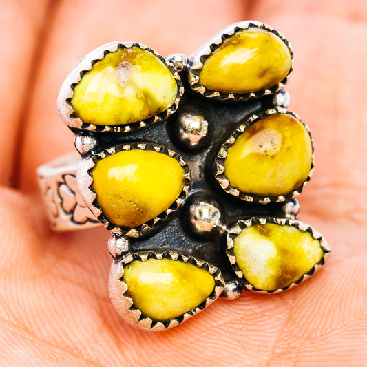 Adjustable silver ring with oval yellow stones, dark bezel, and central silver dots