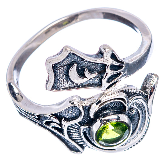 Sterling silver adjustable ring with round peridot-like green center stone and carved details