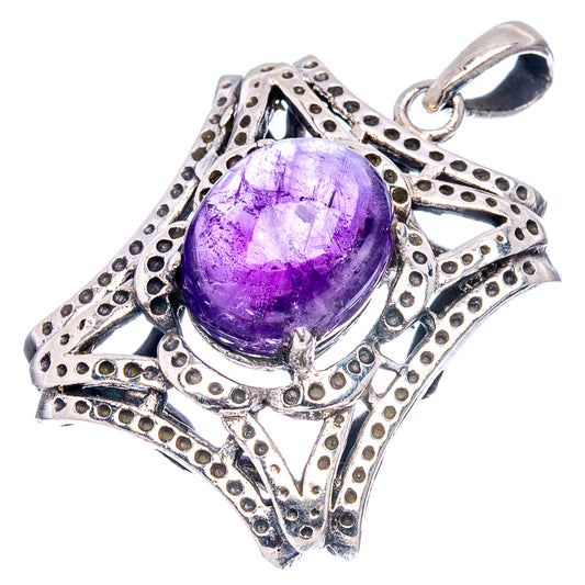 Amethyst sterling silver pendant with oval purple cabochon and ornate filigree setting