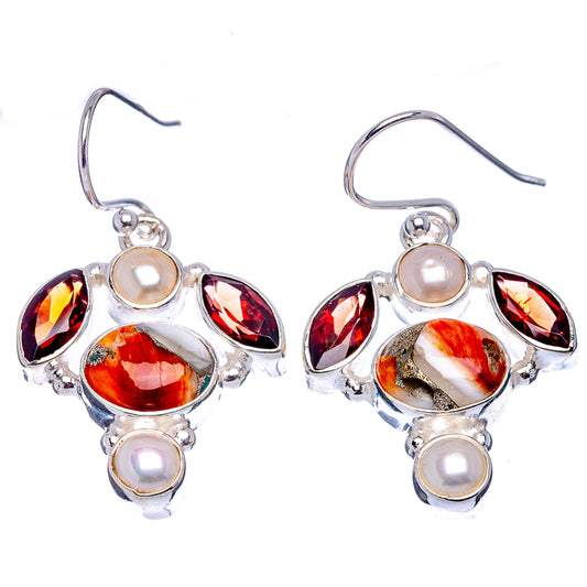 Front view sterling silver drop earrings with spiny oyster, dark red stones, and white pearls