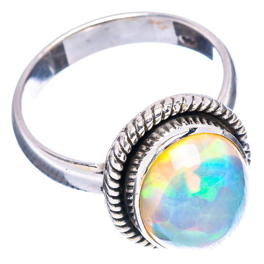 Sterling silver opal ring, oval opal in rope border, side profile view