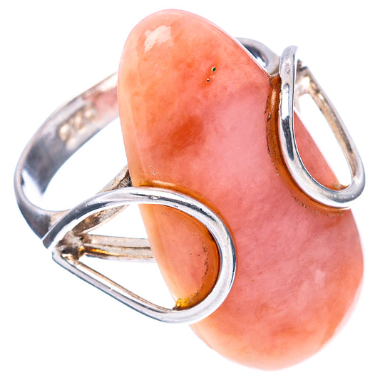 Pink opal ring with oval cabochon, silver prongs, and open split bands
