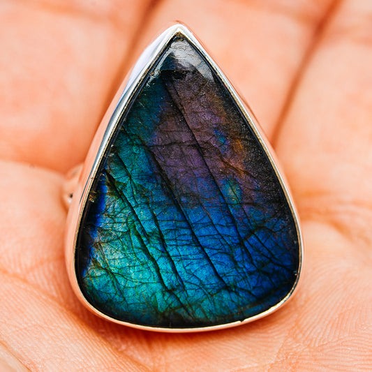 Teardrop labradorite ring showing deep blue and green iridescence in silver bezel