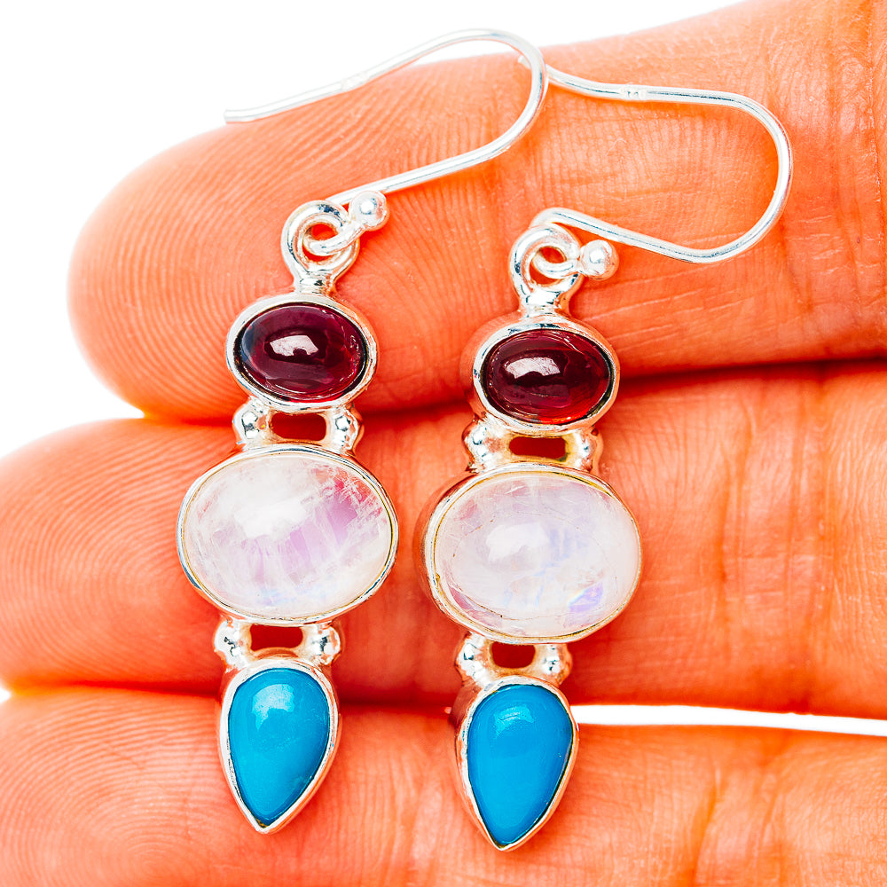 Sterling silver dangle earrings with red, pink moonstone, and blue teardrop accents