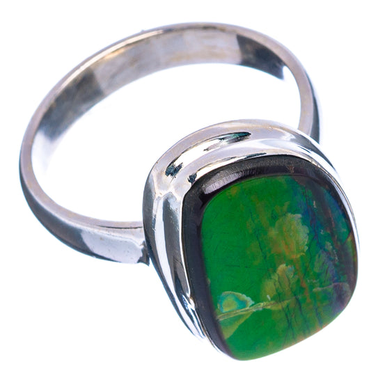 Ammolite ring with green iridescent center and polished silver band, side view