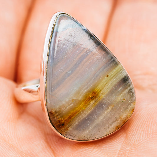 Teardrop .925 sterling silver ring with gray calcite cabochon and golden streaks