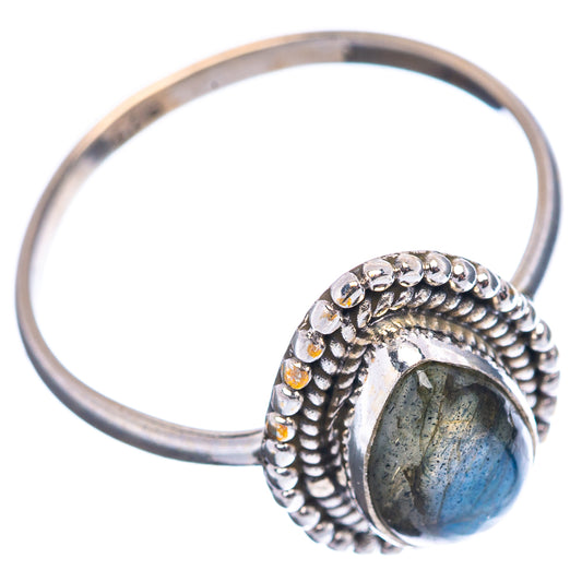Sterling silver band ring with oval labradorite cabochon and textured bezel