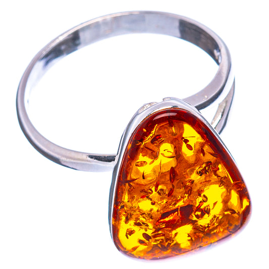 Sterling silver ring with open band and amber teardrop cabochon with gold flecks