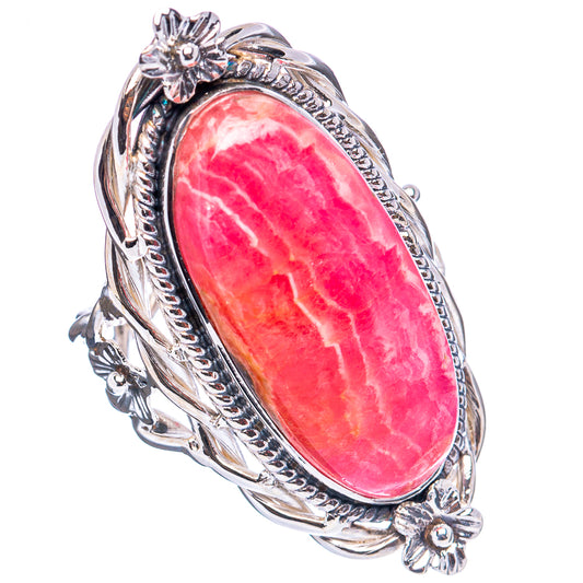 Sterling silver ring with oval pink gemstone and floral side accents, size 7