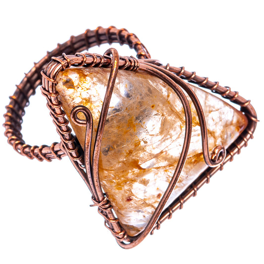 Oxidized copper wire-wrap ring featuring a rutilated quartz teardrop cabochon.