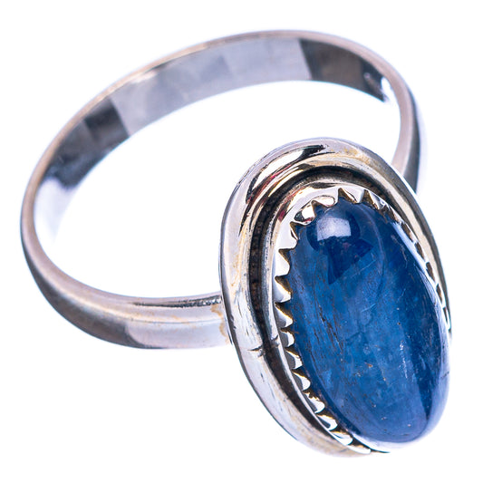 Sterling silver ring band with oval blue kyanite cabochon and textured bezel, side view
