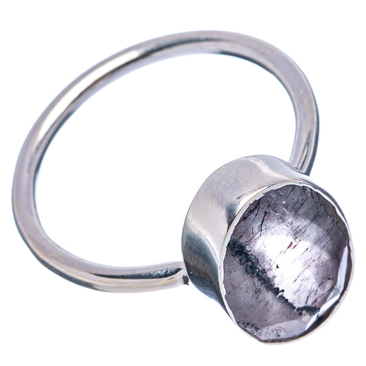 Sterling silver ring with oval gray gemstone in a bezel setting
