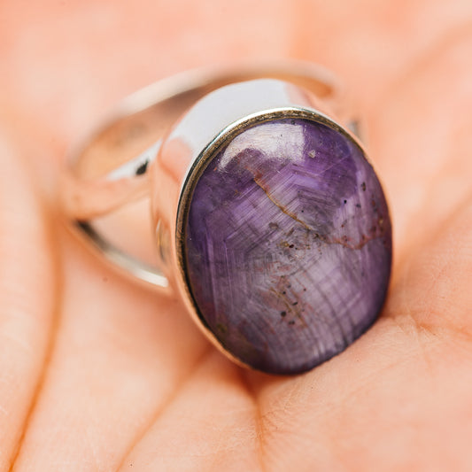 Oval purple gemstone sterling silver ring, side view on finger