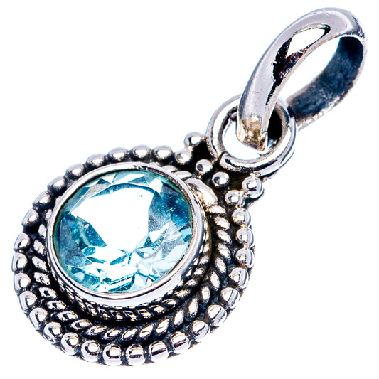 Blue topaz pendant in .925 sterling silver with ornate round bezel and loop bail.