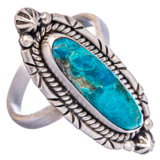 Adjustable sterling silver ring with oval turquoise centerpiece and ornate rope setting