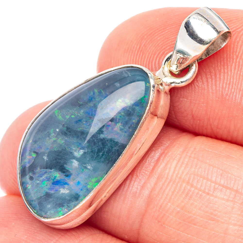 Sterling silver teardrop opal pendant with rainbow opal center