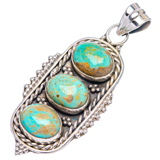 Sterling silver turquoise pendant with three teal cabochons in ornate bezel settings