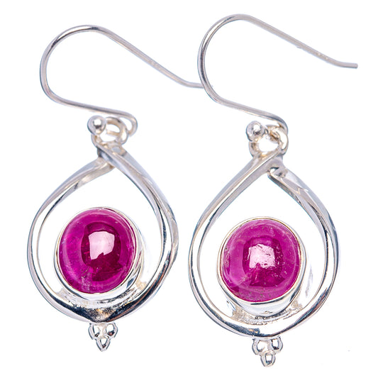 Silver drop earrings with round purple ruby cabochons and curved hoops