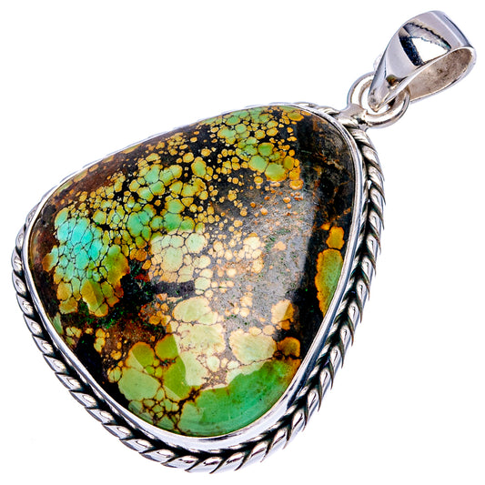 Sterling silver pendant with teardrop turquoise mosaic stone, detailed silver border.