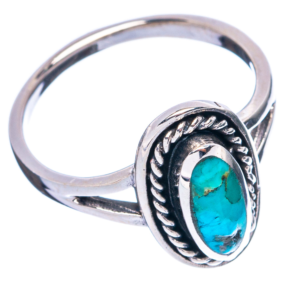 Sterling silver ring with oval turquoise cabochon and ornate bezel detail
