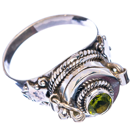 Sterling silver poison ring angled view, green gemstone bezel with twisted rope edges