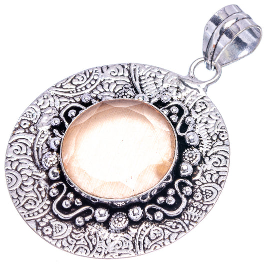 Orange onyx pendant with circular German silver filigree frame and top bail