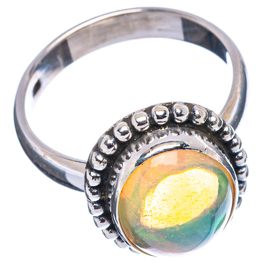 Sterling silver opal ring with oval center, beaded bezel and slim band