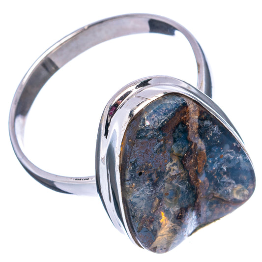 Silver boulder opal ring, oval blue stone bezel with brown matrix; side profile.