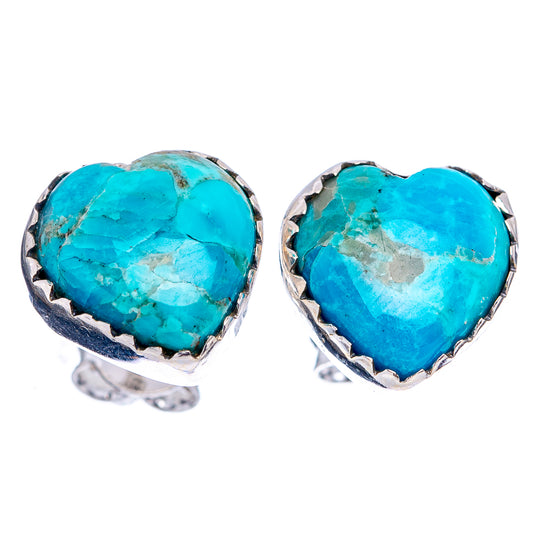 Turquoise heart stud earrings with silver bezel and prong detail.