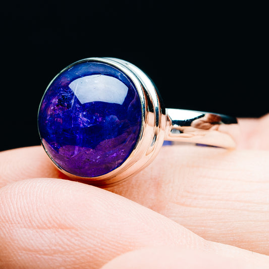 Sterling silver tanzanite ring with oval blue-purple cabochon and polished band