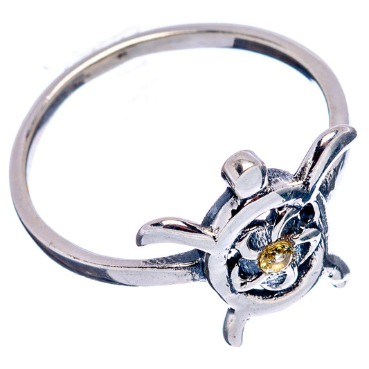 Sterling silver sea turtle ring with citrine-yellow center stone and curved band