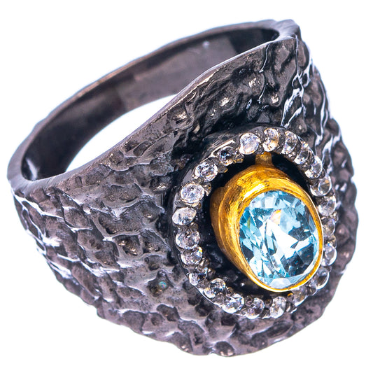 Textured black rhodium ring with oval blue topaz gemstone and sparkling diamond halo