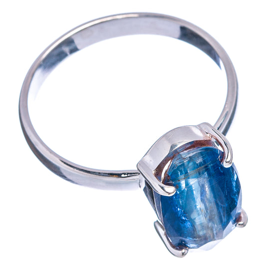 Sterling silver kyanite ring with oval blue gemstone bezel, side view.