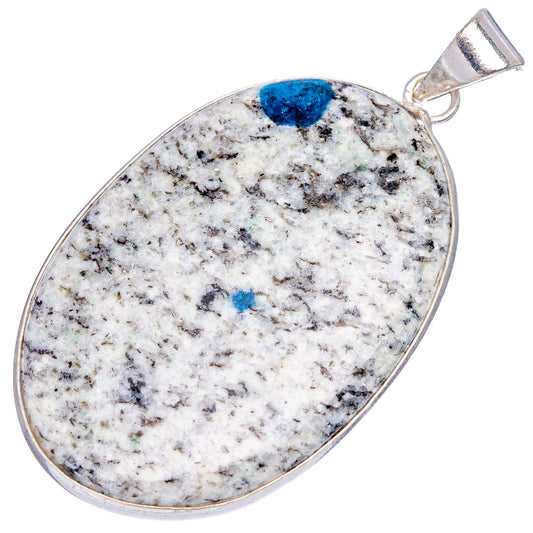 Silver-plated oval pendant with blue azurite spots and white speckled stone, top loop