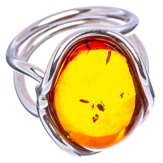 Oval amber cabochon ring in .925 sterling silver, bright yellow with dark inclusions