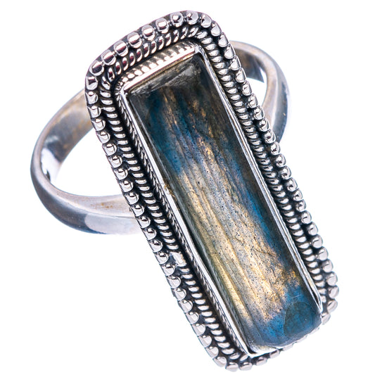 Sterling silver labradorite ring with blue rectangular stone and raised beaded frame.