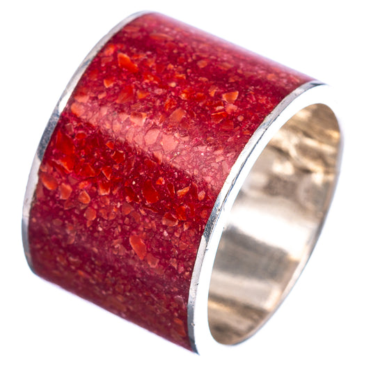 Red coral ring angled view, glittery red inlay set in polished sterling silver band