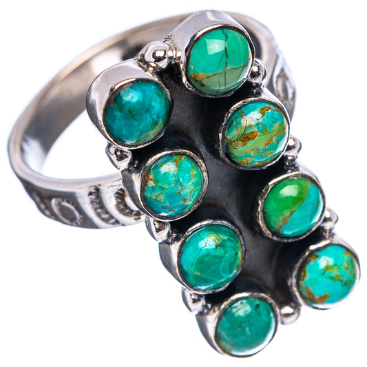 Turquoise cabochon cluster ring on silver band with raised bezel settings