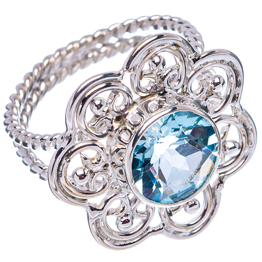 Sterling silver filigree ring with oval light-blue gemstone and detailed band