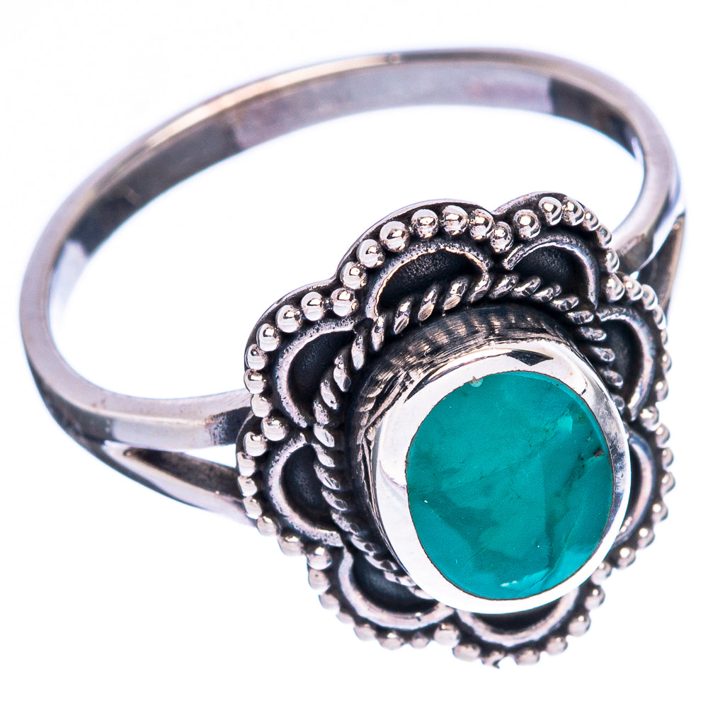 Sterling silver ring with teal oval turquoise stone and detailed bead-and-scroll bezel