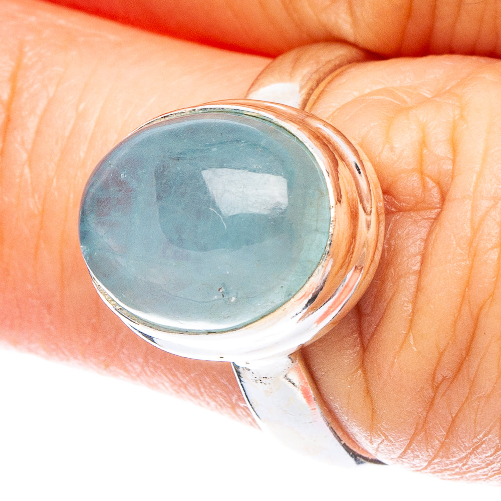Aquamarine blue oval gemstone silver ring with polished bezel