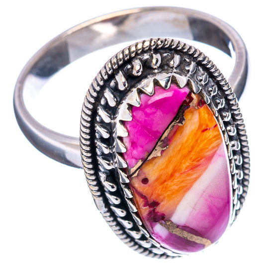 Sterling silver ring with oval pink and orange stone, ornate bezel, wide band