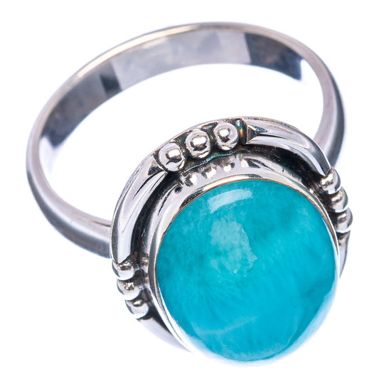 Sterling silver ring with bezel-set oval turquoise larimar cabochon and beaded top
