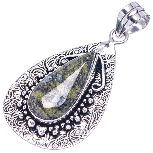Silver-tone teardrop pendant with green-yellow stone and decorative border