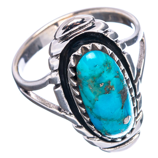 Sterling silver turquoise ring with oval stone set in ornate metal frame