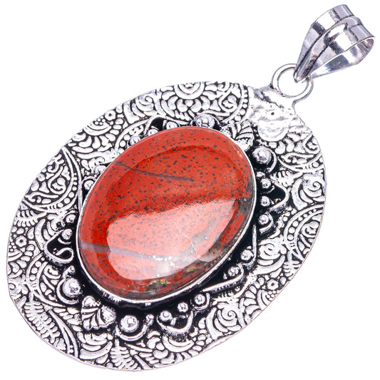 Red jasper oval pendant in ornate German silver frame with top bail